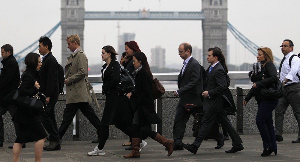 UK business workers in front of Tower Bridge